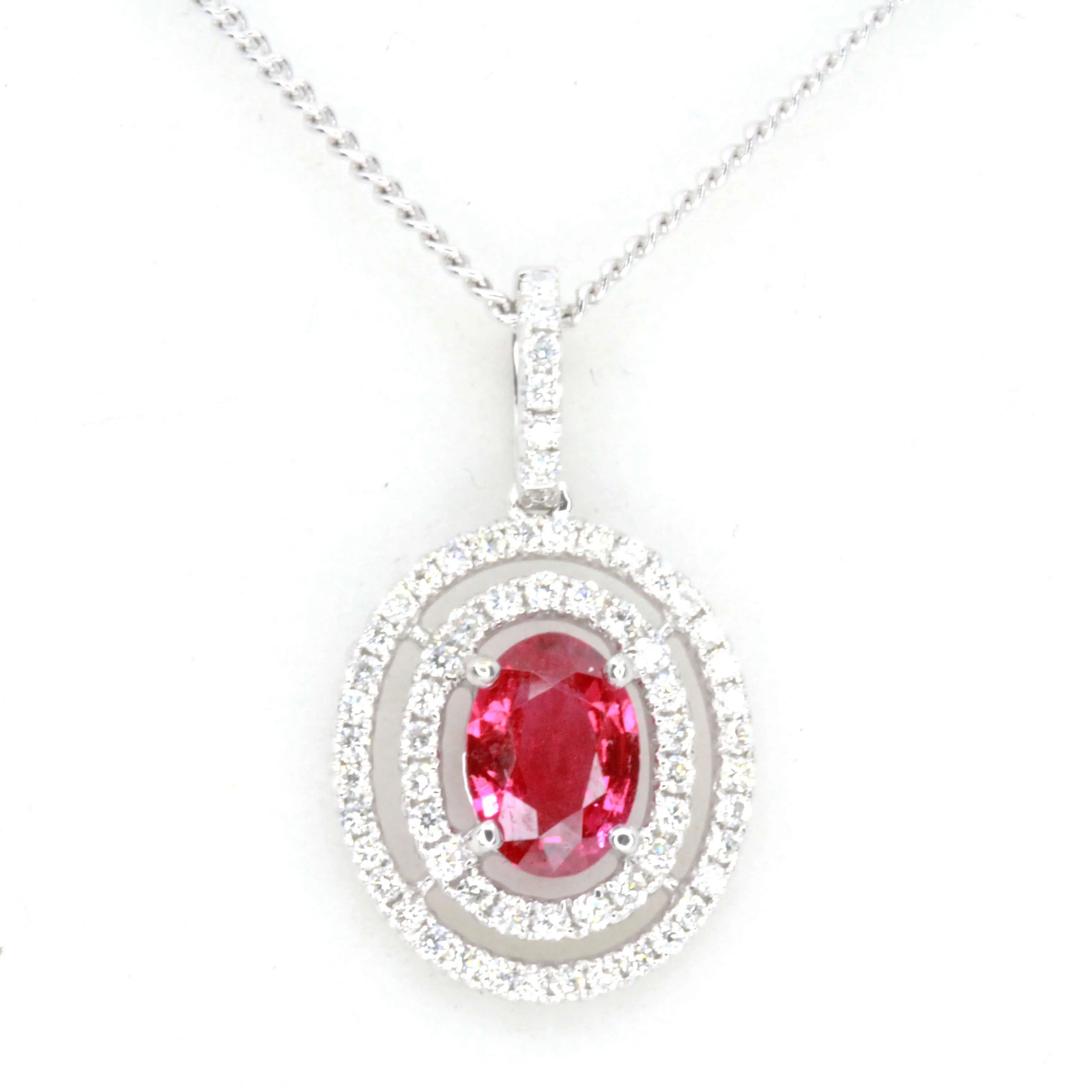 Oval Ruby Pendant with Halo of Diamonds set in 18ct White Gold