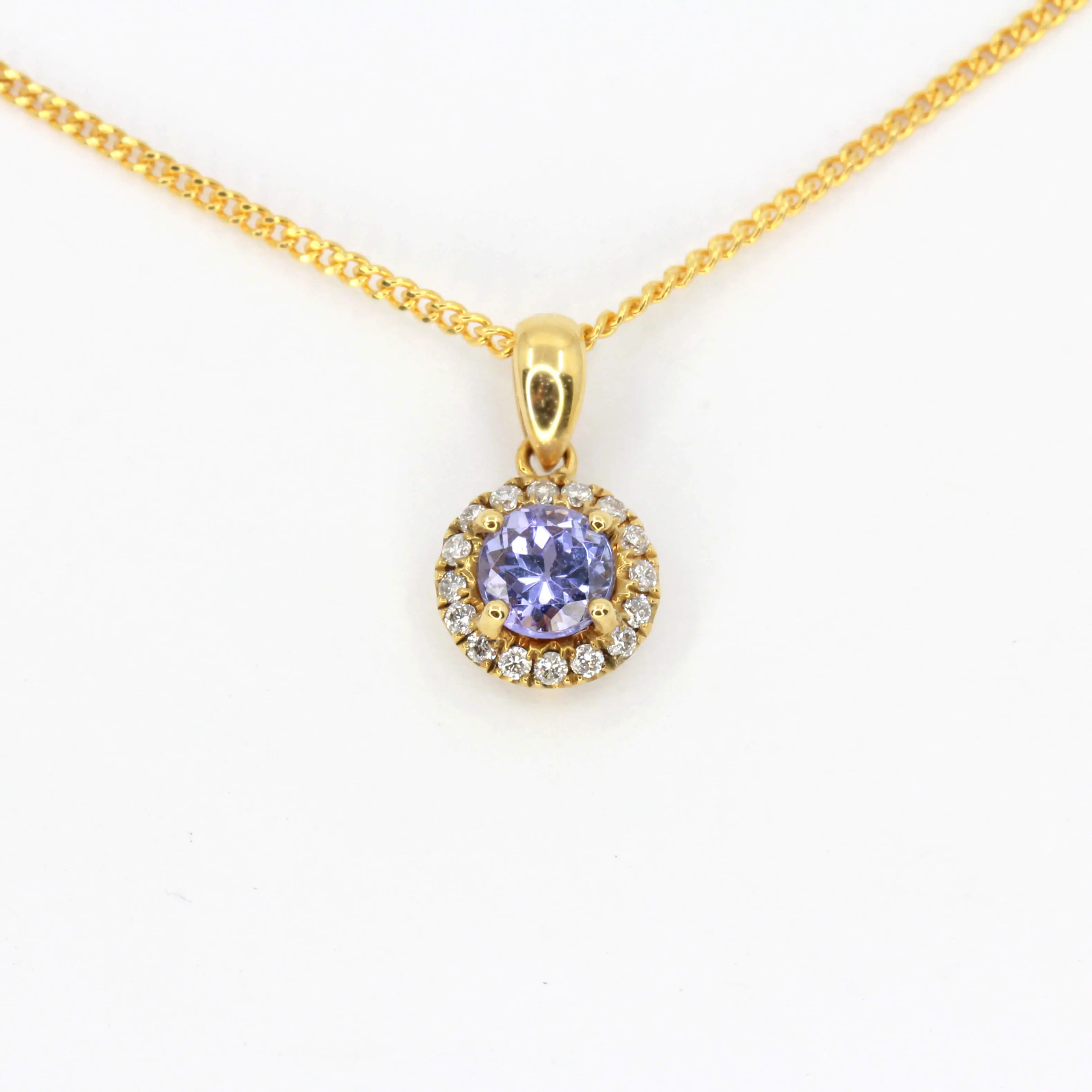 Round Cut Tanzanite Pendant with Diamonds set in 18ct Yellow Gold