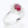 Oval Cut Ruby Ring with Diamond Halo Set in 18ct White Gold
