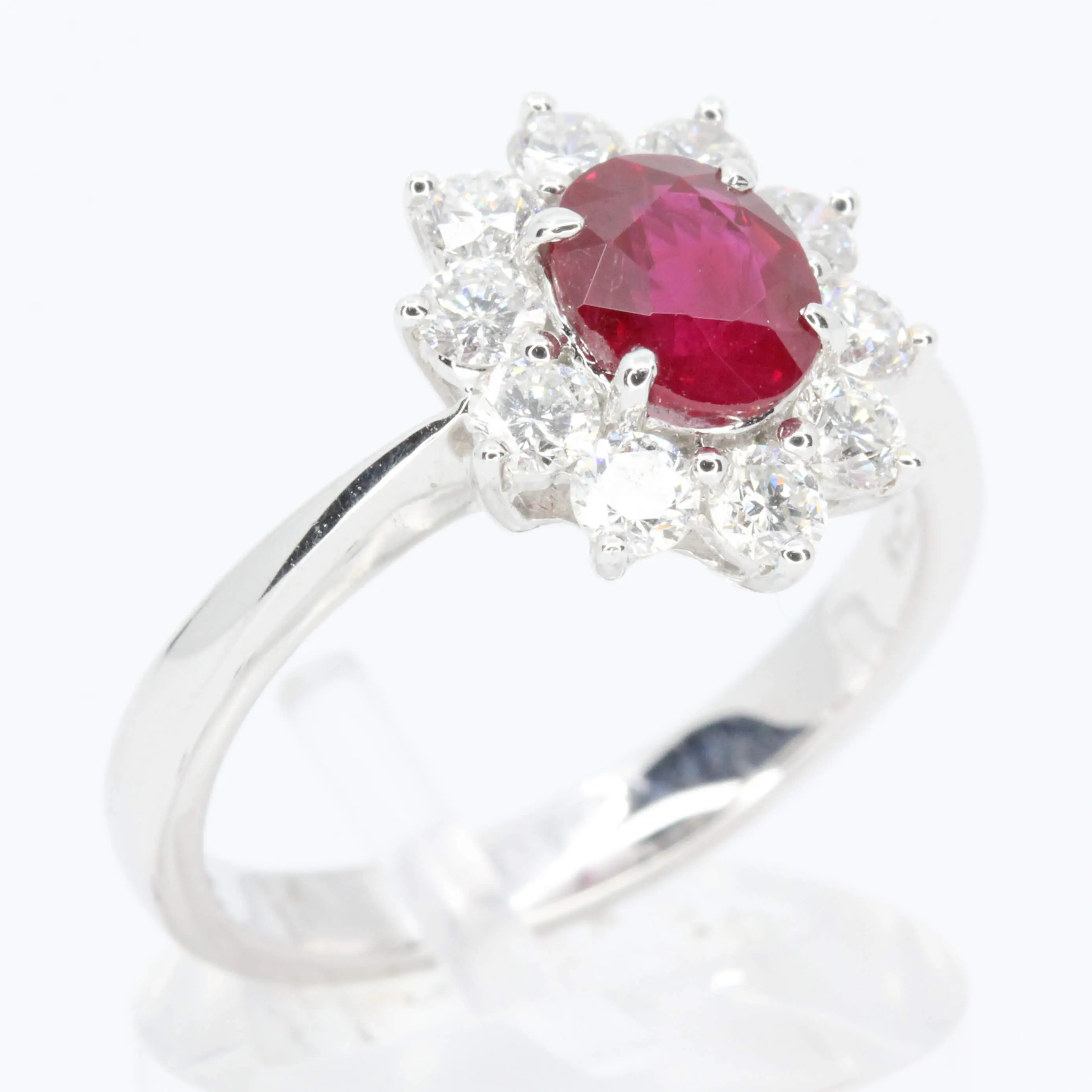 Oval Cut Ruby Ring with Diamond Halo Set in 18ct White Gold
