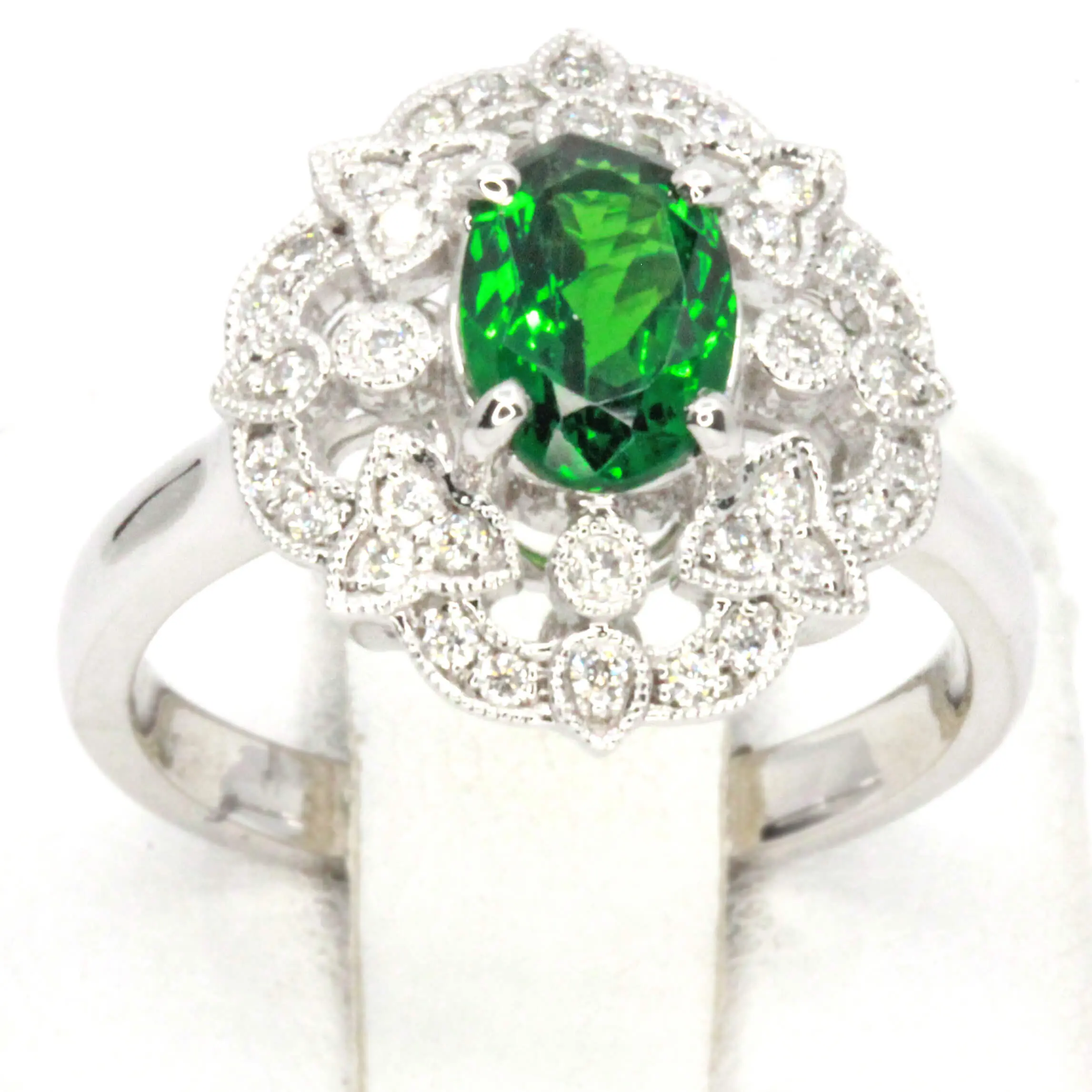 Oval Cut Tsavorite Ring with Halo of Diamonds Set in 18ct White Gold