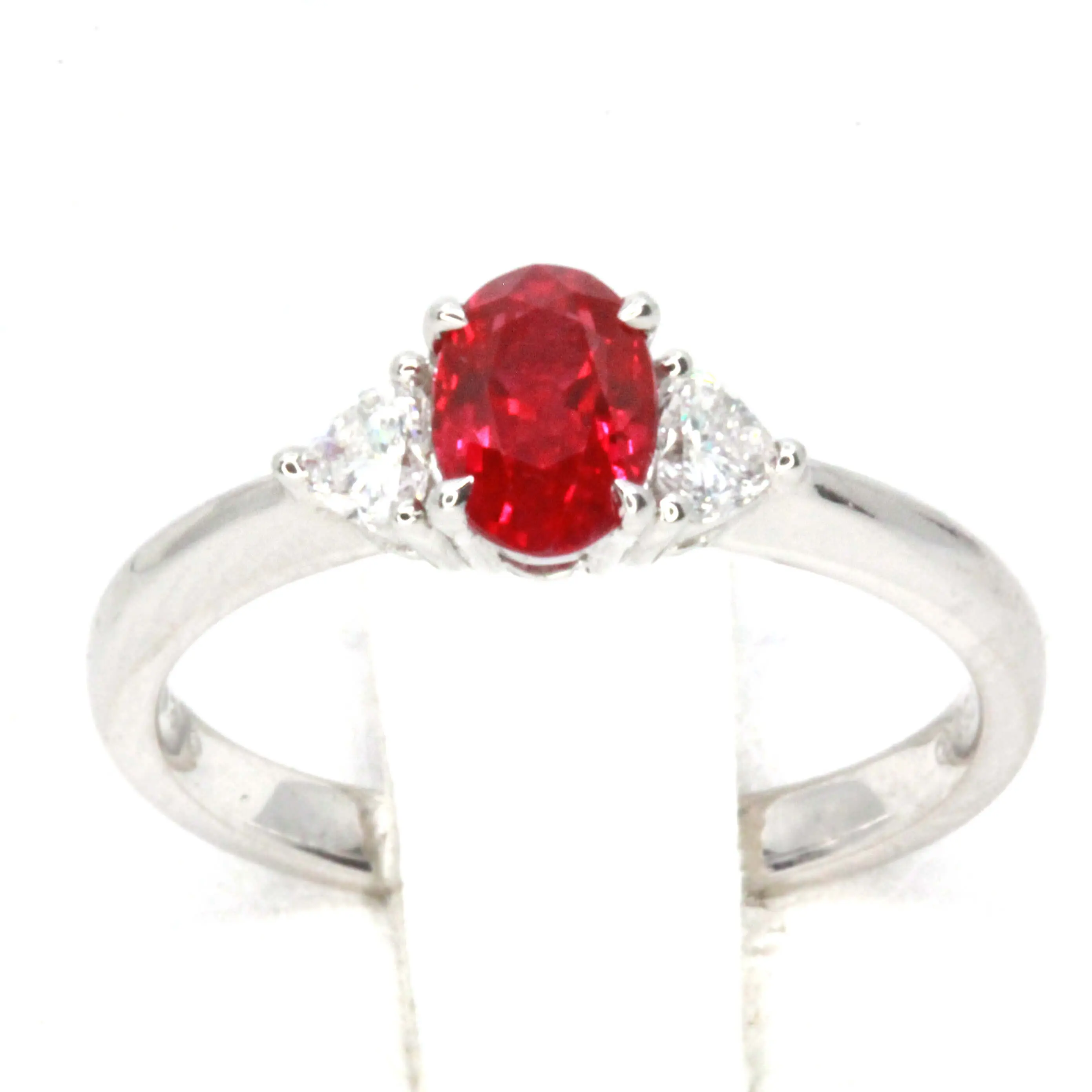 Oval Cut Ruby Ring with Heart Shape Diamonds Set in 18ct White Gold