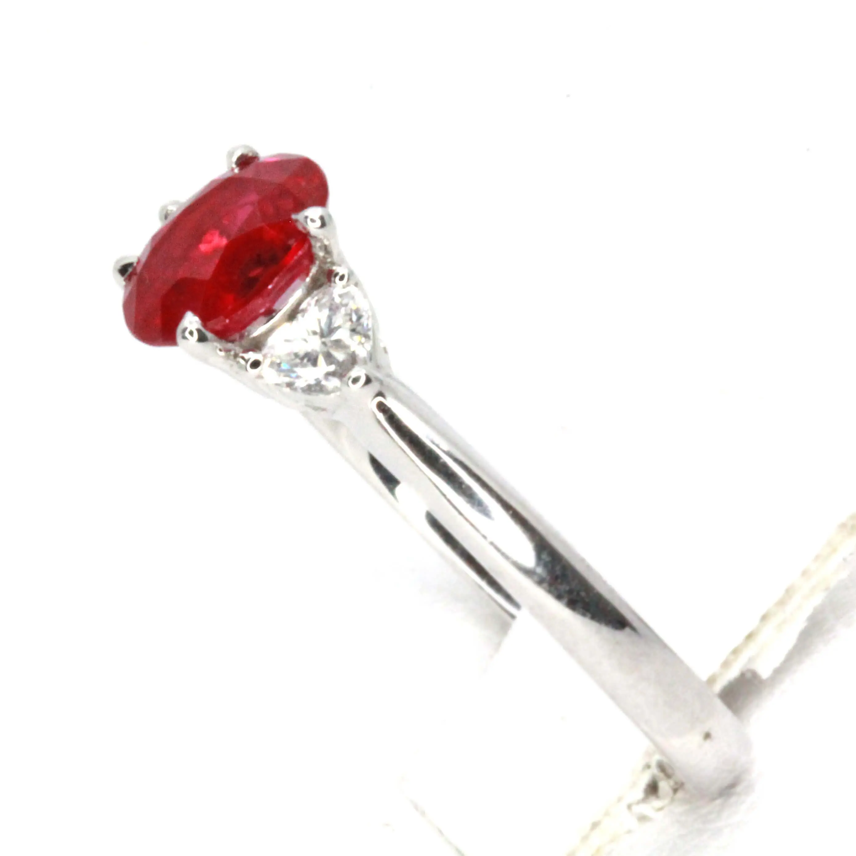 Oval Cut Ruby Ring with Heart Shape Diamonds Set in 18ct White Gold