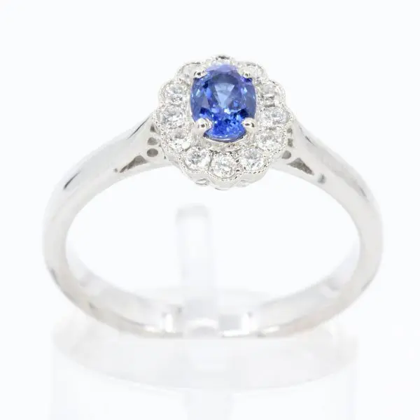 Oval Shape Sapphire Ring with Diamond Halo Set in 18ct White Gold