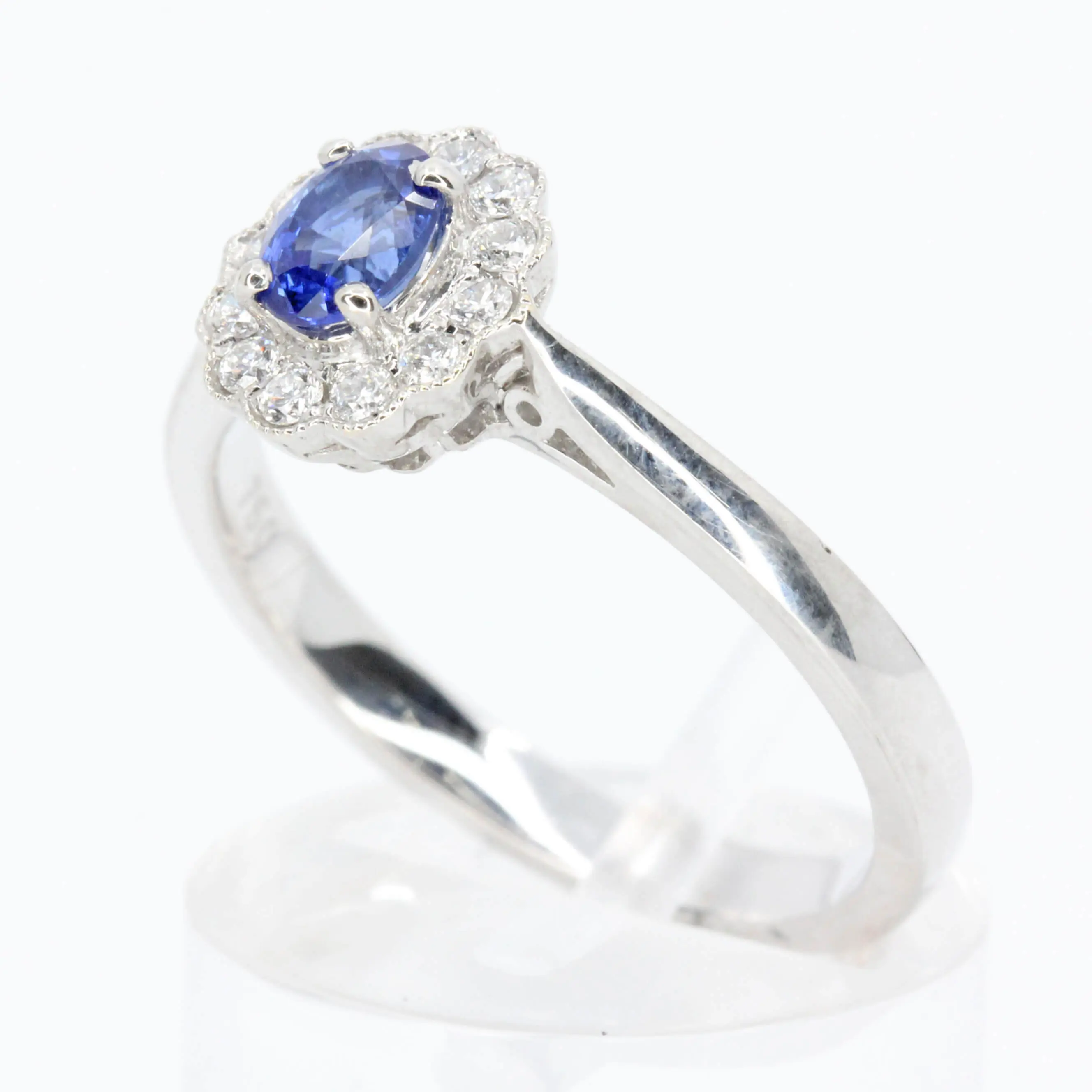Oval Shape Sapphire Ring with Diamond Halo Set in 18ct White Gold
