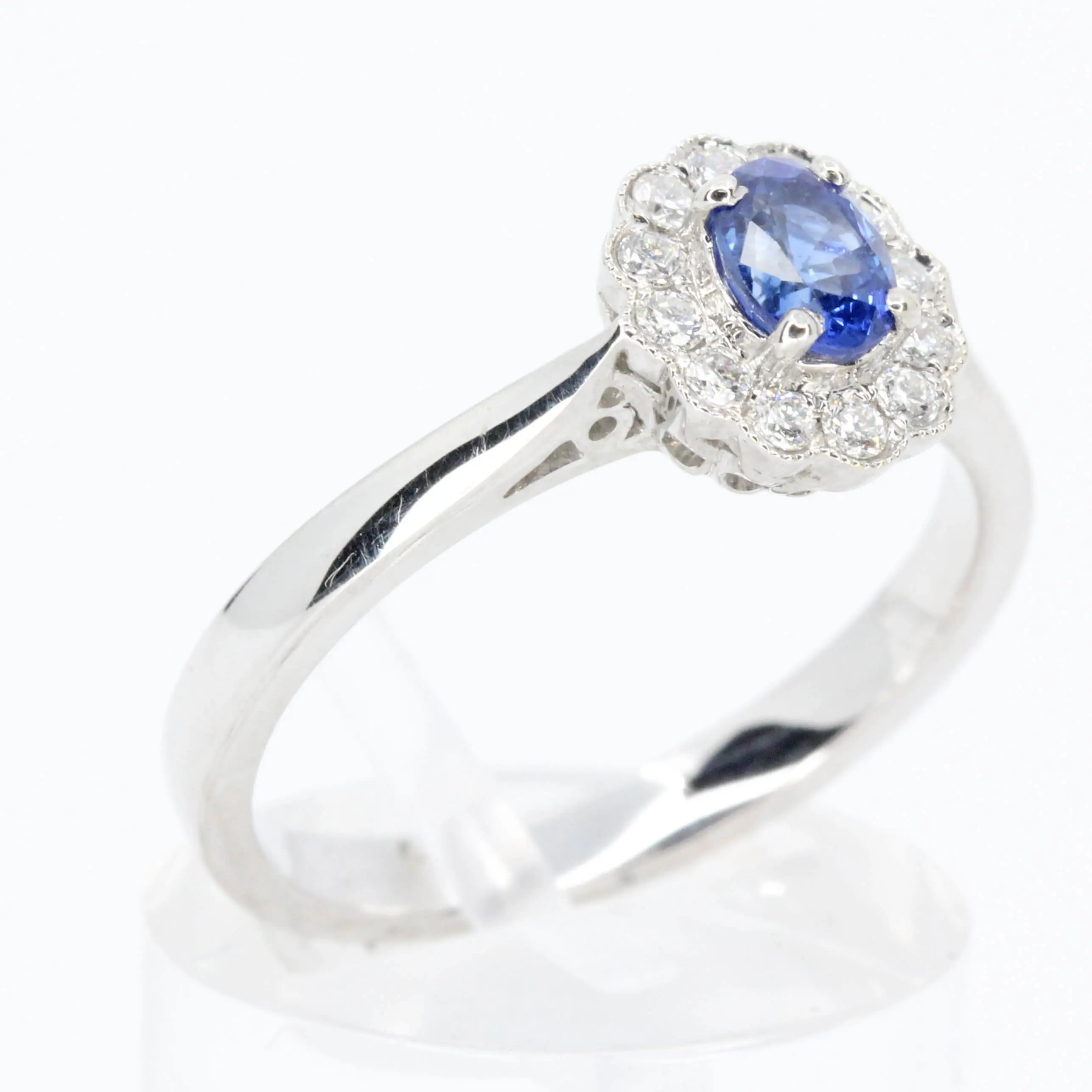 Oval Shape Sapphire Ring with Diamond Halo Set in 18ct White Gold