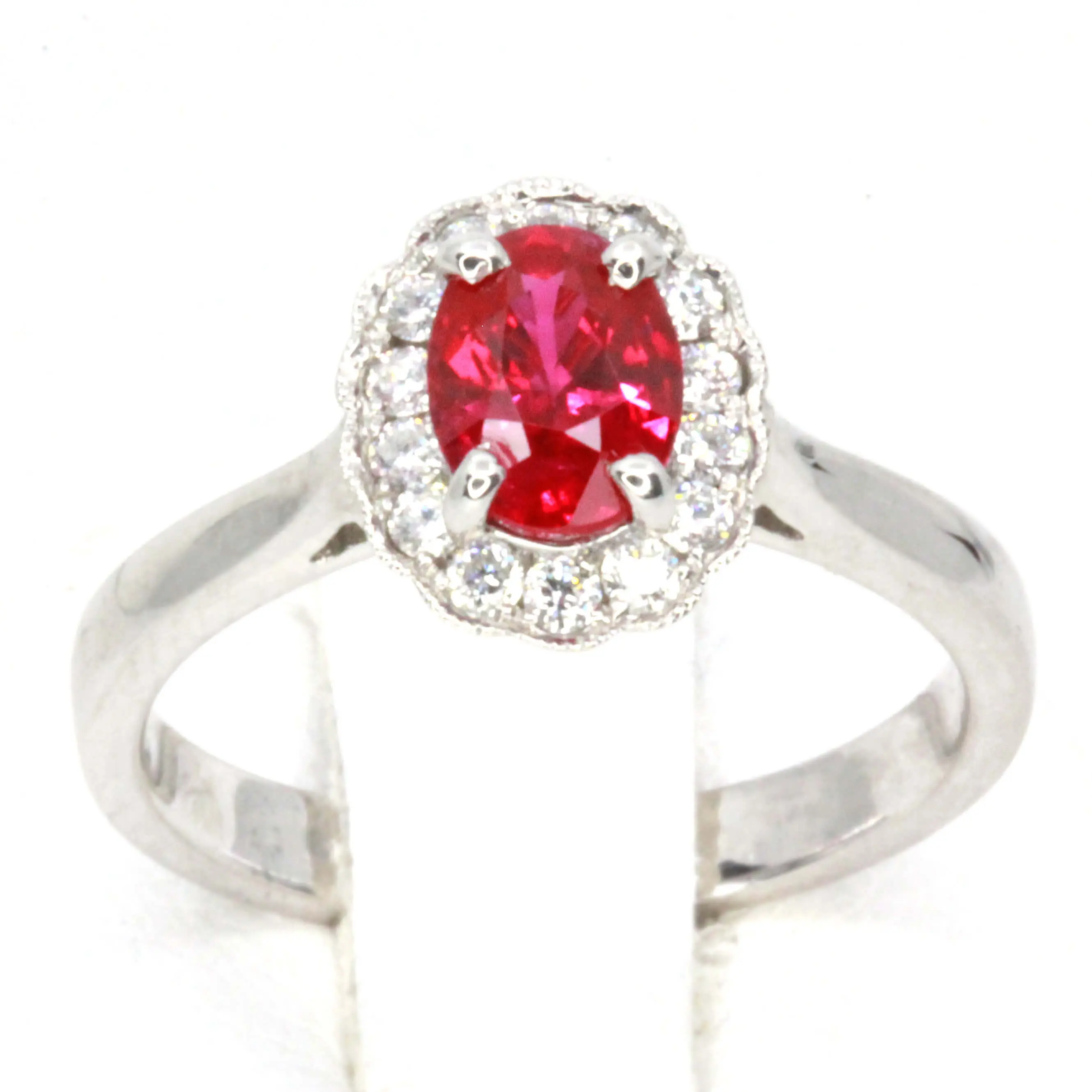Oval Shape Ruby Ring with Halo of Diamonds Set in 18ct White Gold