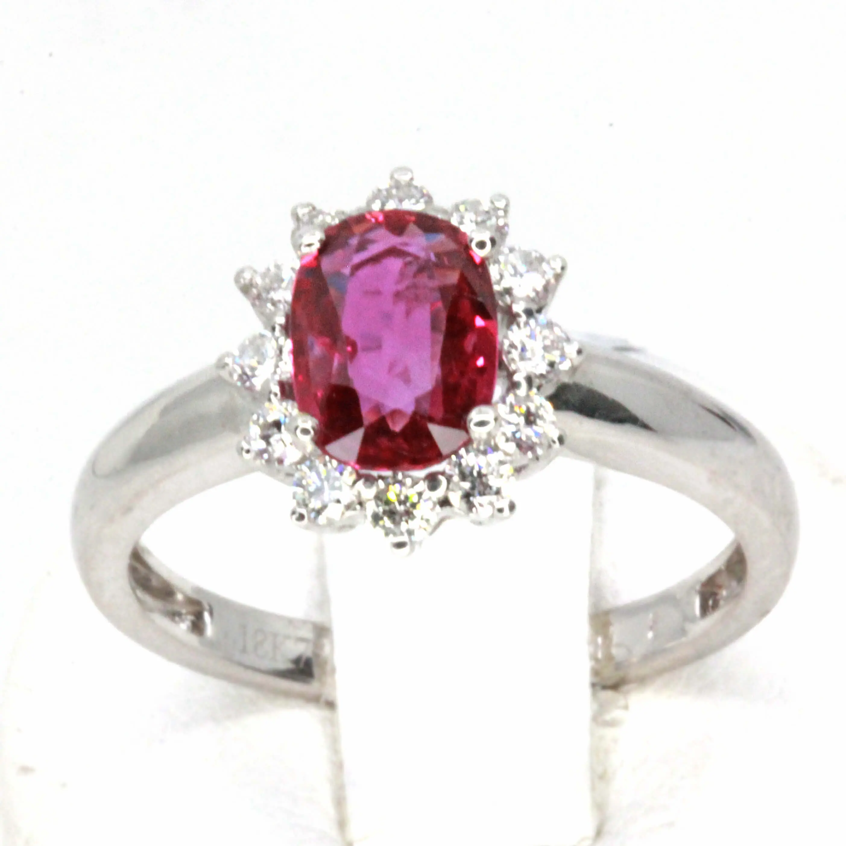 Oval Shape Ruby Ring with Halo of Diamonds Set in 18ct White Gold