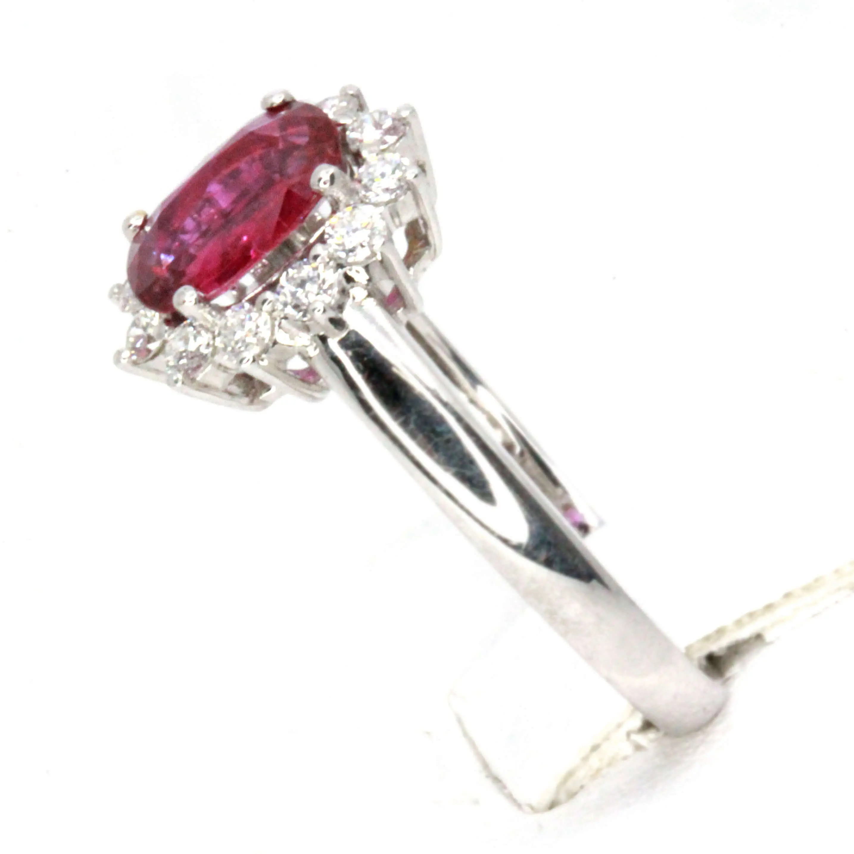 Oval Shape Ruby Ring with Halo of Diamonds Set in 18ct White Gold