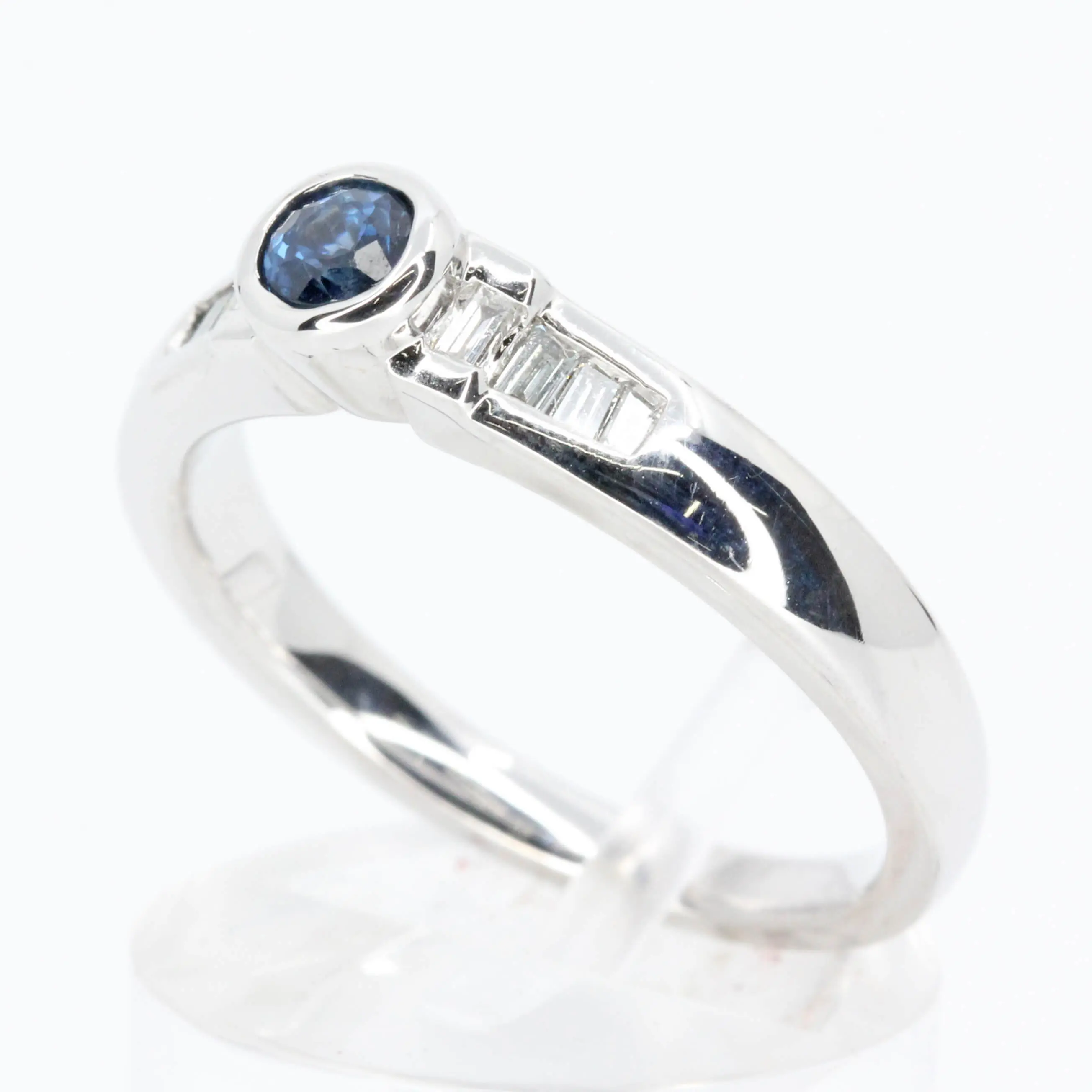 Round Cut Solitaire Australian Sapphire Ting with Accents of Diamonds Set in 18ct White Gold