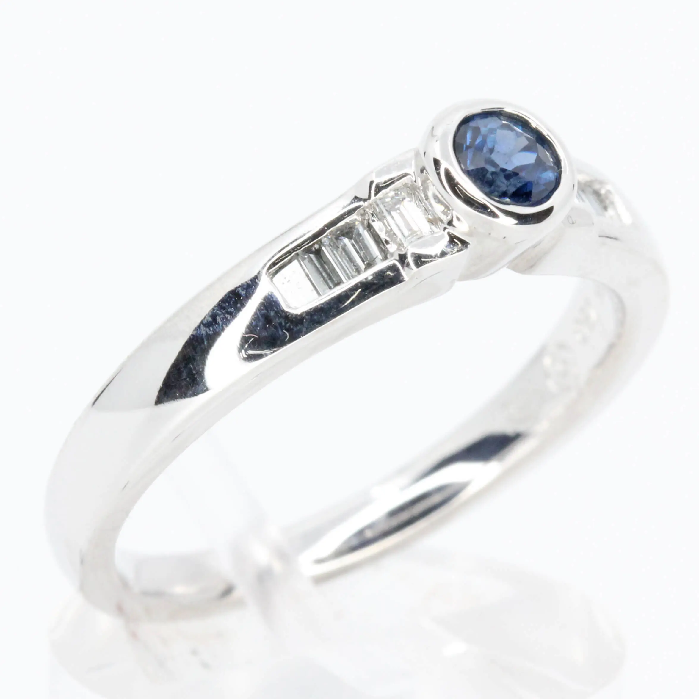 Round Cut Solitaire Australian Sapphire Ting with Accents of Diamonds Set in 18ct White Gold