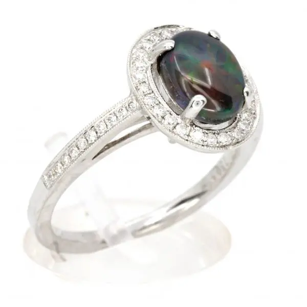 Oval Black Opal Ring with Halo of Diamonds set in 18ct White Gold