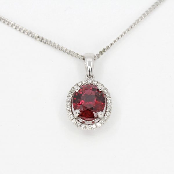 Oval Rhodolite Garnet Pendant with Halo of Diamonds set in 18ct White Gold