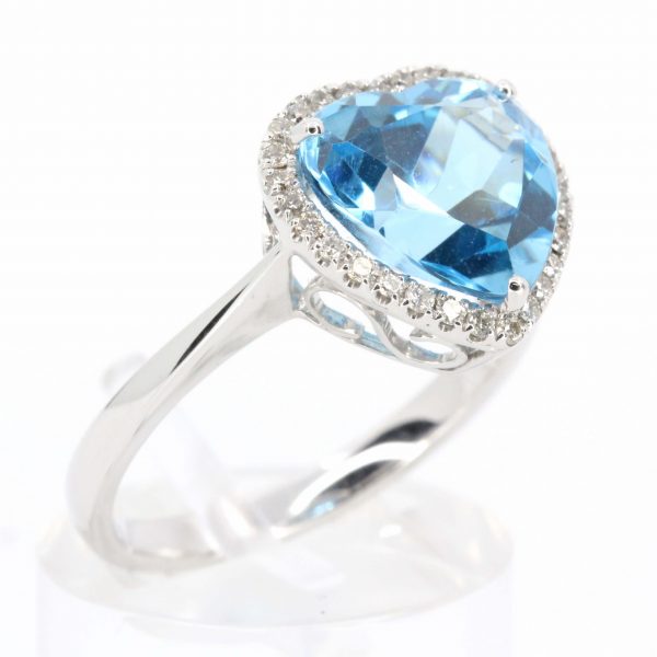 Heart Shape Blue Topaz Ring with Halo of Diamonds Set in 18ct White Gold