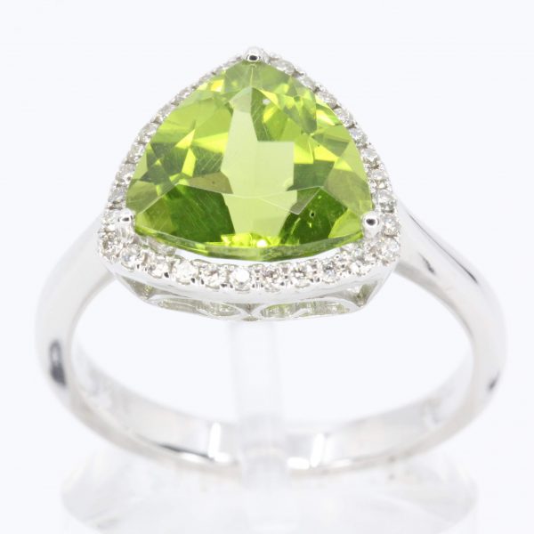 Trillion Cut Peridot Ring with Halo of Diamonds Set in 18ct White Gold