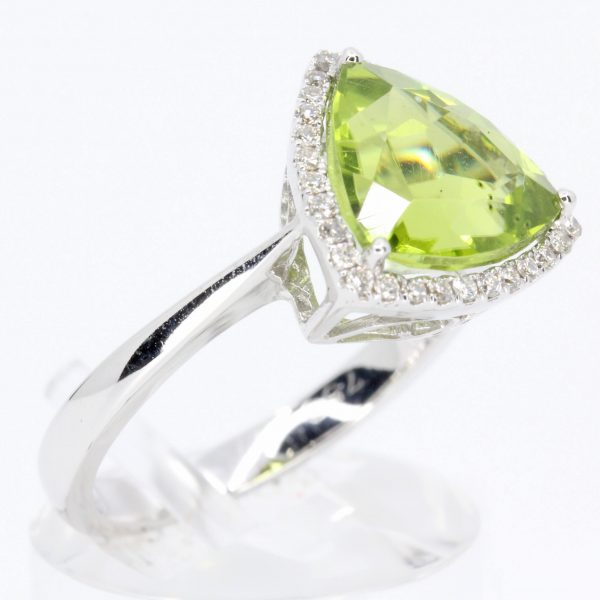 Trillion Cut Peridot Ring with Halo of Diamonds Set in 18ct White Gold
