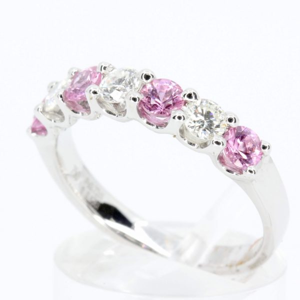 Round Cut Pink Sapphire Ring with Halo of Diamonds Set in 18ct White Gold