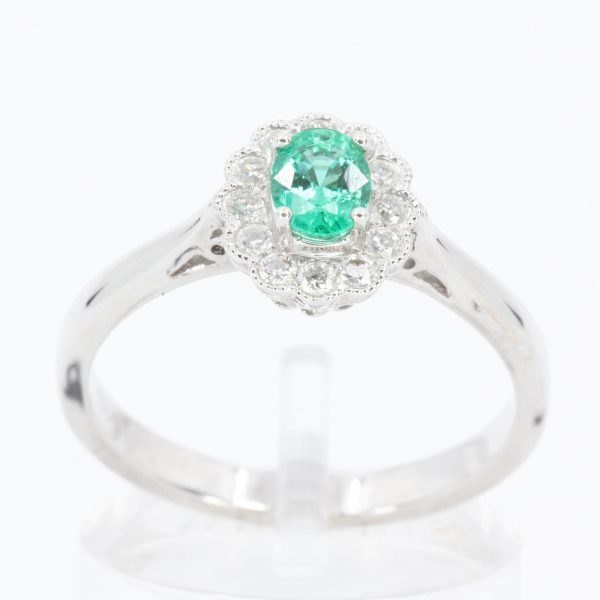 Oval Emerald Ring with Mil-grain Diamond Halo Set in 18ct White Gold