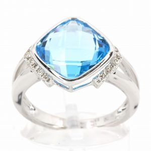 Cushion Cut Blue Topaz Ring with Accents of Diamonds Set in 18ct White Gold