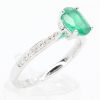 Oval Cut Solitaire Emerald Ring with Accents of Diamonds Set in 18ct White Gold