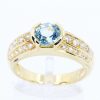Round Cut Blue Topaz Ring with Accents of Diamonds Set in 18ct White Gold