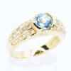 Round Cut Blue Topaz Ring with Accents of Diamonds Set in 18ct White Gold
