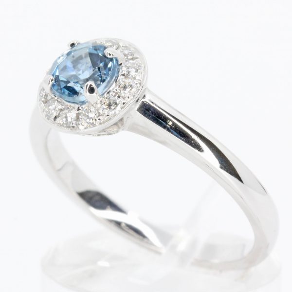 Round Cut Aquamarine Ring with Halo of Diamonds Set in 18ct White Gold
