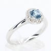 Round Cut Aquamarine Ring with Halo of Diamonds Set in 18ct White Gold