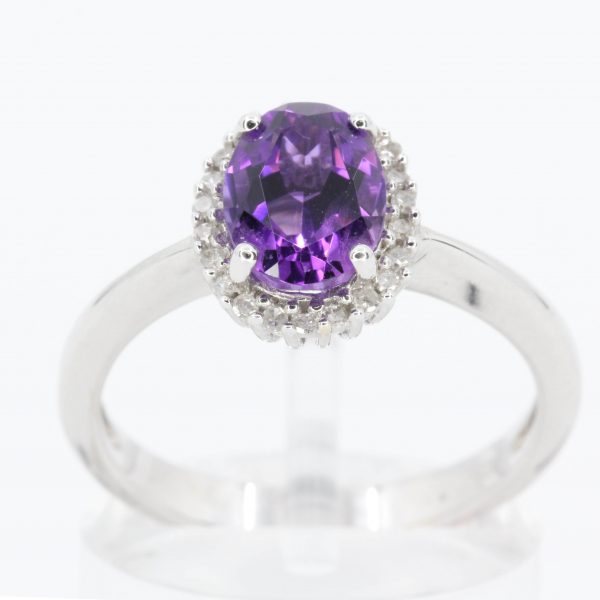 Oval Shape Amethyst Ring with Halo of Diamonds Set in 18ct White Gold
