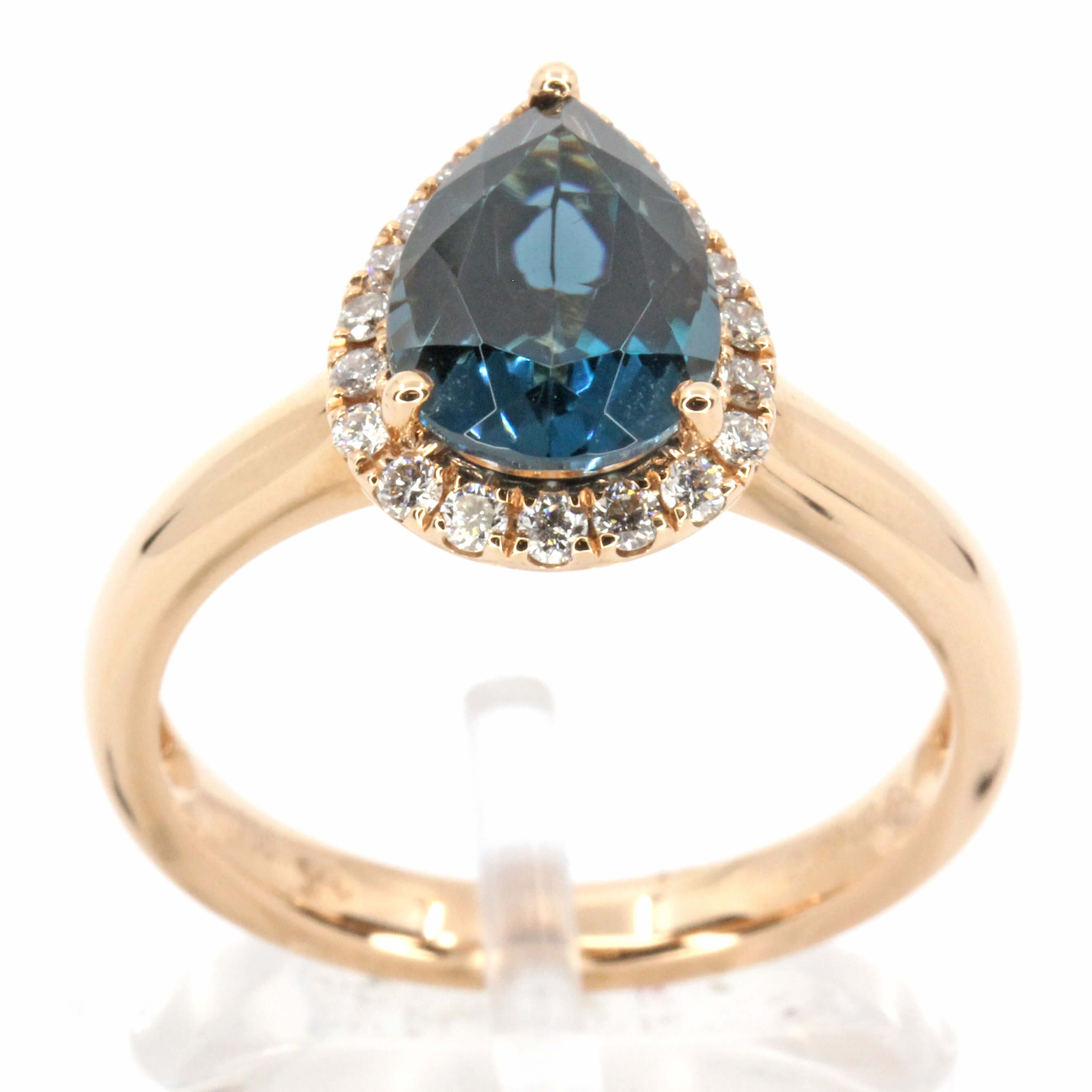 Pear Cut Lodon Blue Topaz Ring with Halo of Diamonds Set