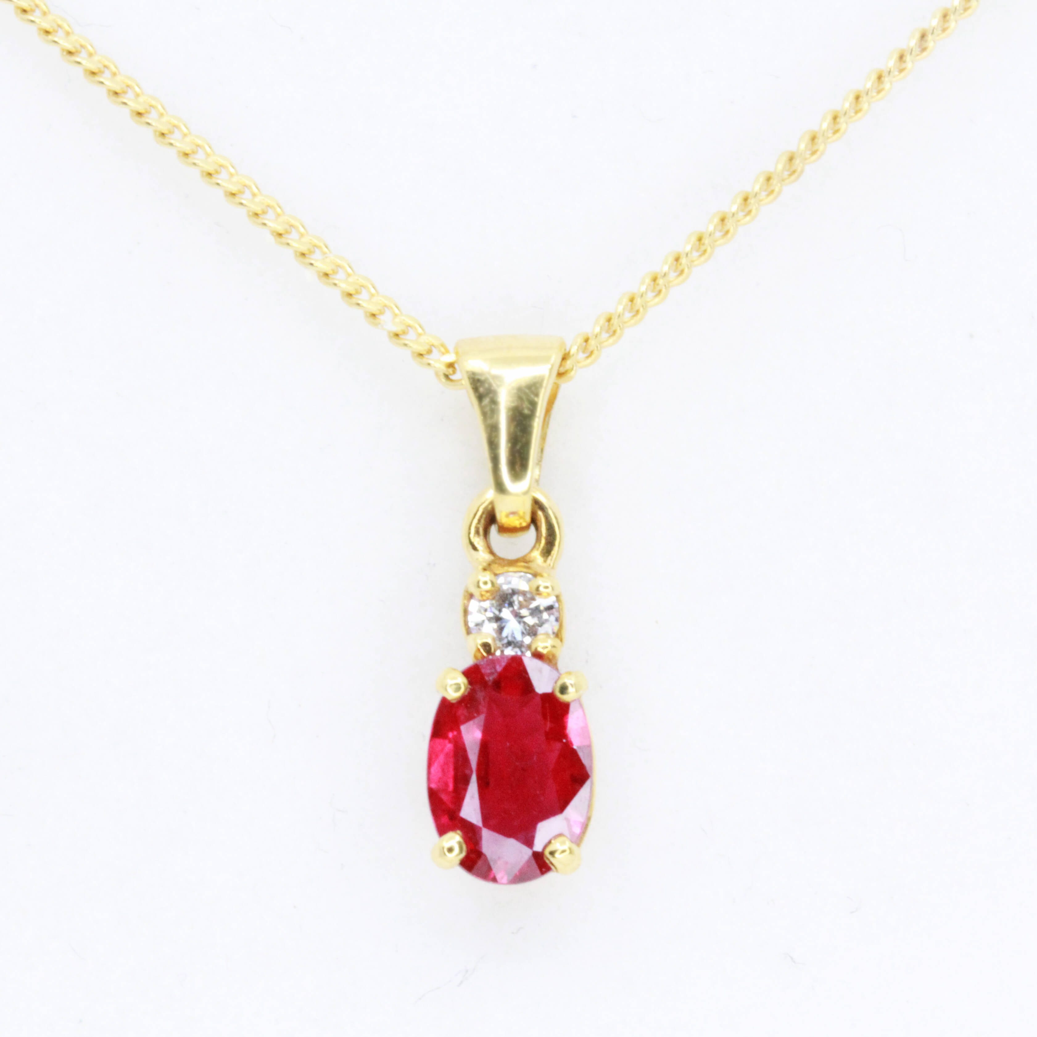 Oval Cut Ruby Pendant with Diamonds set 