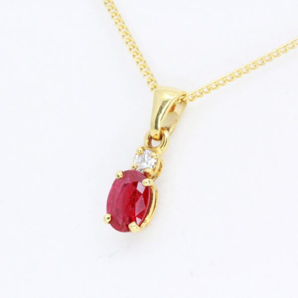 Oval Cut Ruby Pendant with Diamonds set in 18ct Yellow Gold