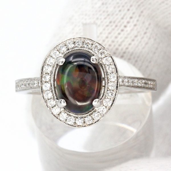 Oval Black Opal Ring with Halo of Diamonds