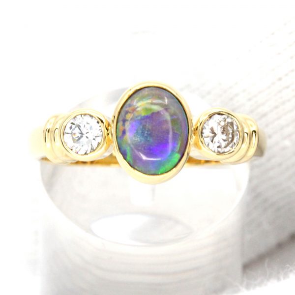 Oval Grey/Dark Opal With Diamonds set in 18ct Yellow Gold